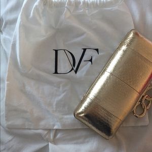Diane Von Furstenberg gold hard shell clutch